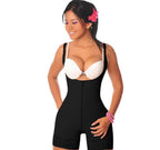 Woman wearing a black shapewear garment on a white background