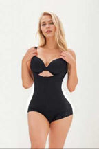 Woman wearing a black bodysuit against a white background