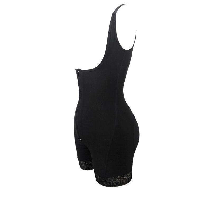 Black bodysuit with lace trim on a white background
